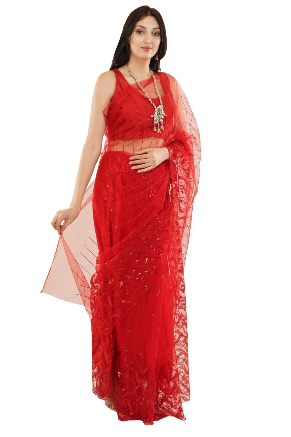 Model in a red embellished saree with sheer pallu photographed full length on a plain white background, even lighting, drape and border clearly visible for an apparel catalogue