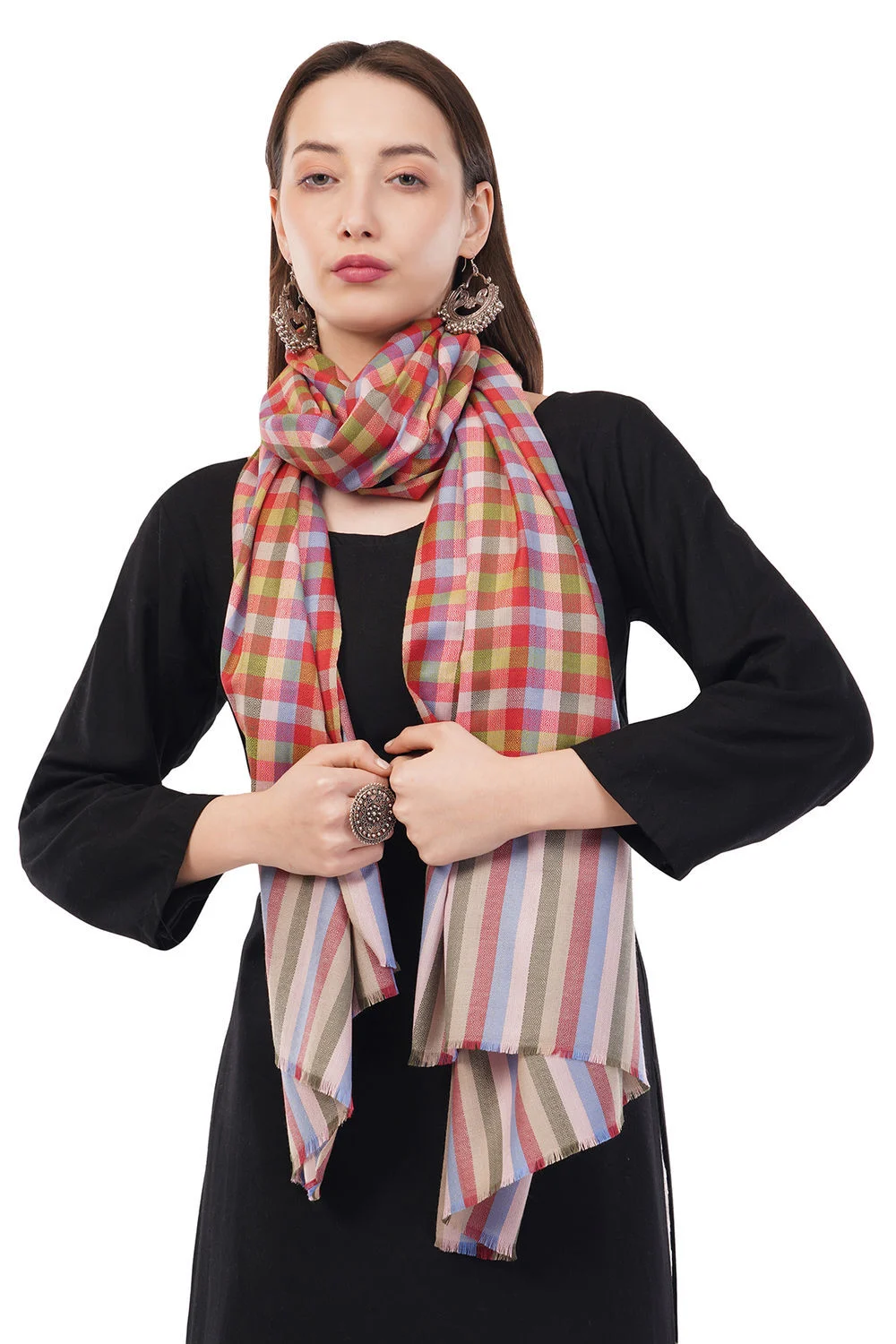 Model in a black dress tying a checkered multicolour scarf against a white background, an on-model frame that shows drape, length and true pattern colours