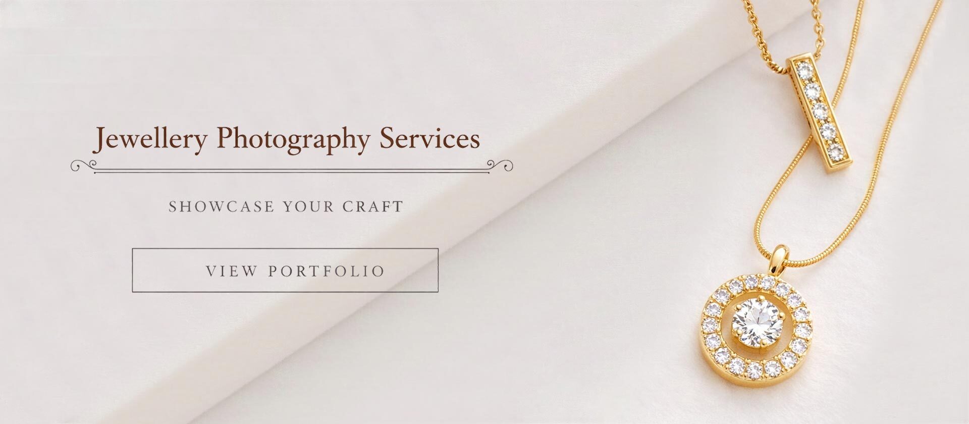 Ckstudio shot of two gold necklaces with diamond pendants on soft white fabric — Jewellery Photography