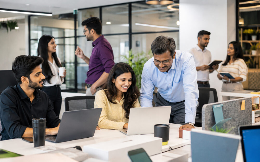 Employee lifestyle photography session capturing engaged workplace culture and corporate team interaction in office