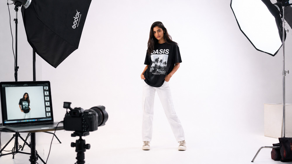 Clean white background fashion photography of Indian model wearing modern streetwear on pure seamless backdrop, even softbox lighting, Myntra Amazon Ajio catalogue-style ecommerce fashion trend 2026 shot in Delhi NCR by Ckstudio
