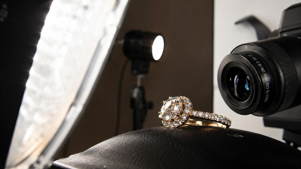 Close-up macro photograph of diamond ring showing sparkle fire and brilliance achieved through professional jewellery photography lighting setup