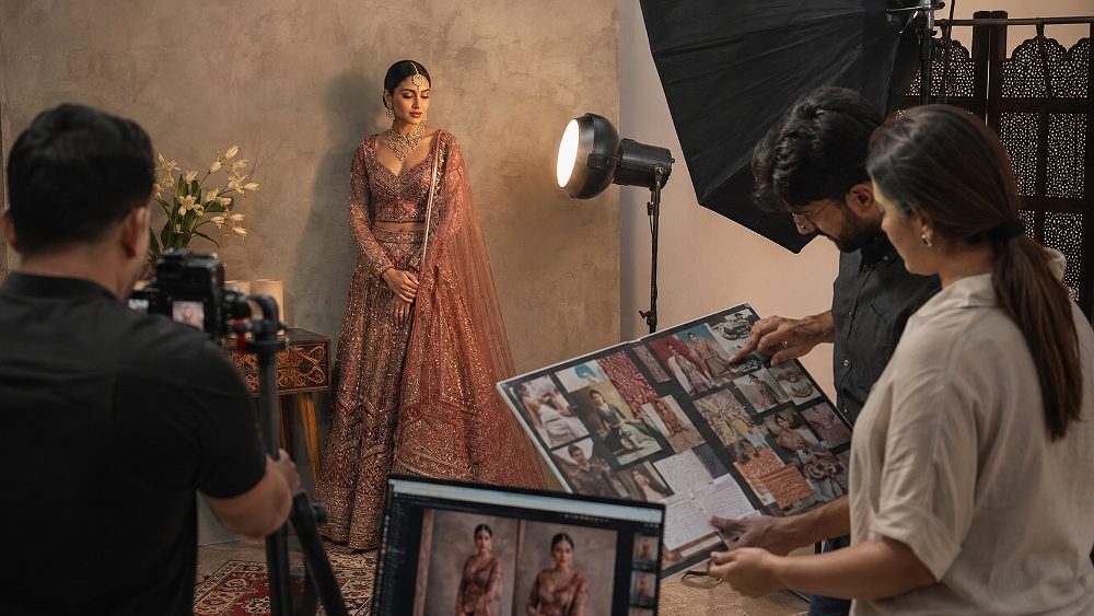 Behind the scenes of behind the scenes editorial Fashion Catalogue Photography set with female model in bridal lehenga