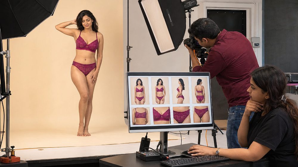 Behind the scenes of real adult Indian female model wearing a coordinated lingerie set during a live catalogue