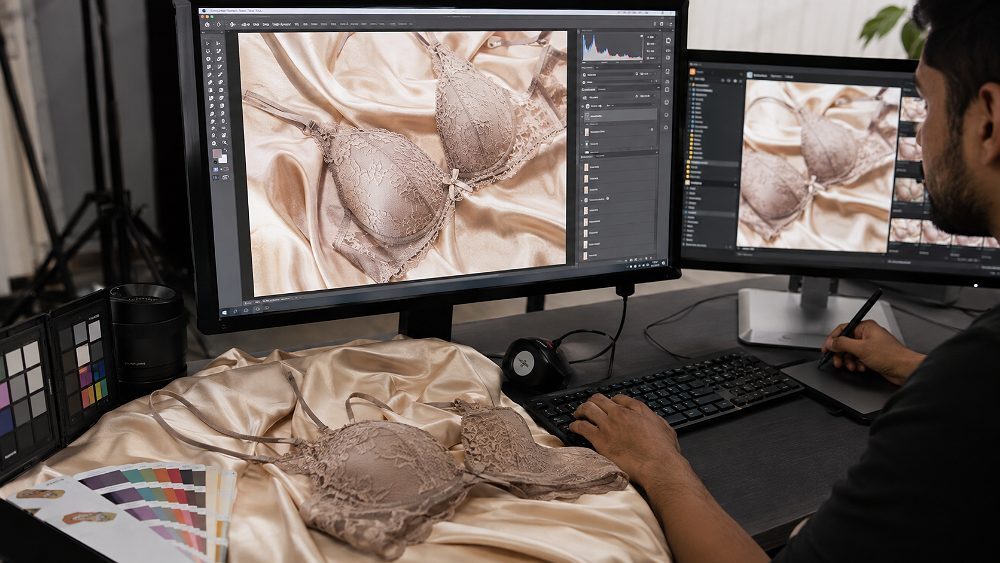 Behind the scenes of editorial retouching workspace at an Indian standard ecommerce photography studio showing a lace