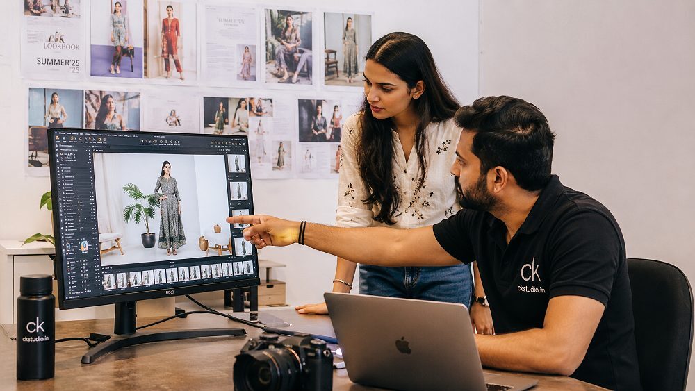 Behind the scenes of prince founder of Ckstudio reviewing tethered Fashion Catalogue Photography frames on large monitor