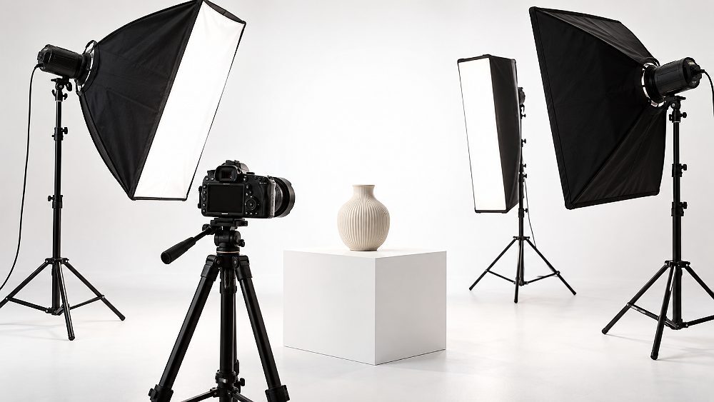 Behind the scenes of professional softbox lighting equipment on a clean white studio background illustrating the