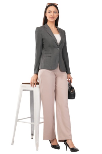 Shot of woman in grey blazer and beige pants on white stool and background — Ckstudio Commercial Product Photography