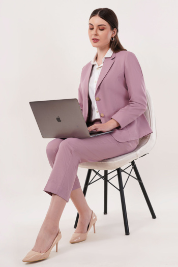 B) woman in mauve suit with laptop on white chair, studio shot — Ckstudio Commercial Product Photography