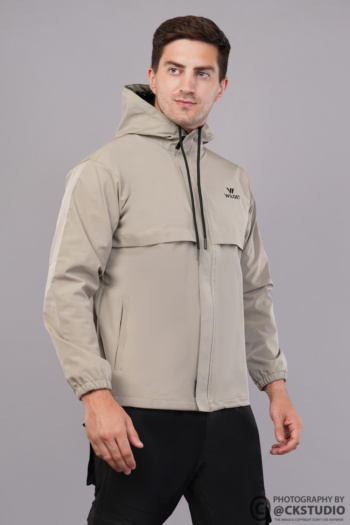 Shot of man wearing beige hooded jacket on gray background — Ckstudio Commercial Product Photography