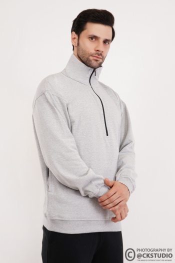 Shot of male model wearing grey zip-up sweatshirt on white background — Ckstudio Commercial Product Photography