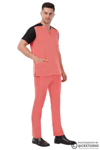 Shot of male model wearing coral and black scrubs on white background — Ckstudio Commercial Product Photography