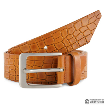 Ckstudio shot of a textured brown belt on a clean white background — Commercial Product Photography.