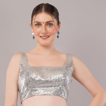 Model wearing a sequined top against a neutral backdrop — Ckstudio; Commercial Product Photography.