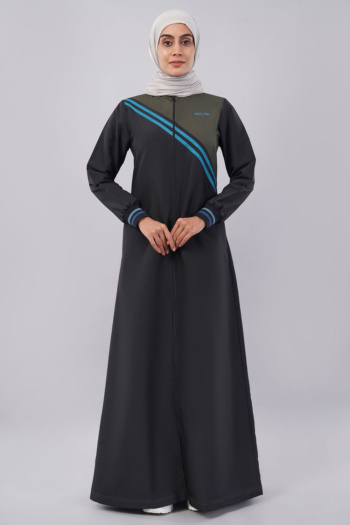 B) model wearing long black and olive dress with blue stripes, shot on gray background — Ckstudio Commercial Product Photography