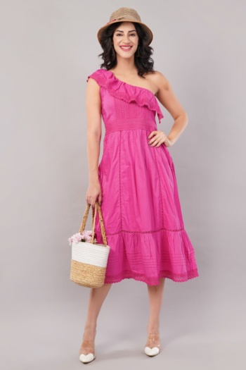 B woman in pink one-shoulder dress holding a straw bag, standing on light gray background, Model Photography shot — Ckstudio