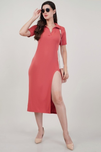 Ckstudio shot of model wearing coral slit dress on plain light gray background — Garment Photography