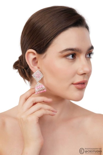 Ckstudio shot of woman wearing pink and silver earrings on white background, Jewellery Photography