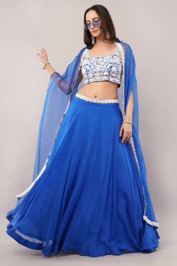 B woman wearing blue embroidered ethnic outfit, studio background, Commercial Product Photography shot — Ckstudio