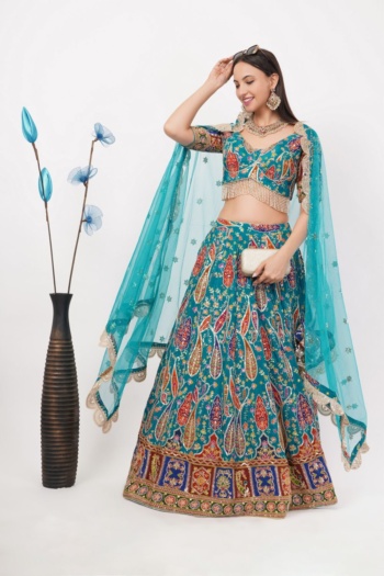 Bengal blue embroidered lehenga with dupatta and clutch, model smiling on white background, E-Commerce Photography shot — Ckstudio