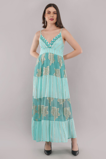 B) model wearing turquoise embroidered maxi dress, shot on plain gray background — Ckstudio, Garment Photography