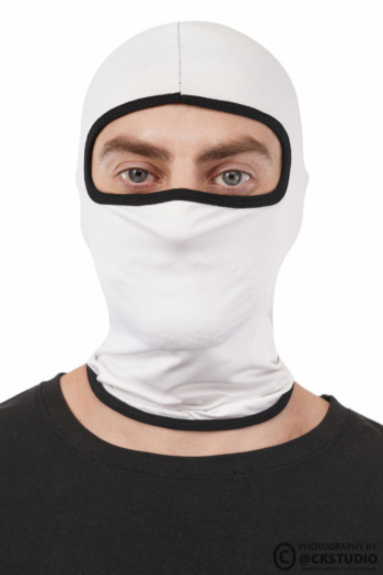 Ckstudio shot of a model wearing a white balaclava on a plain background — Commercial Product Photography.
