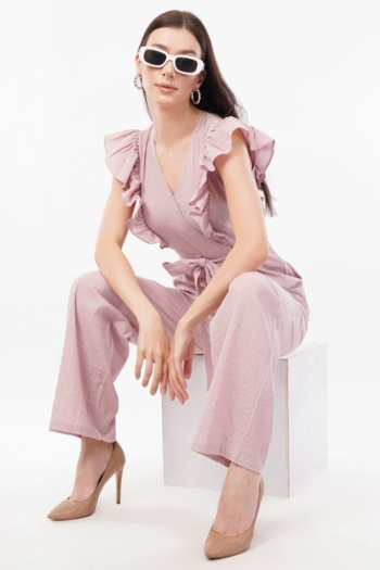 Shot of model wearing pink ruffled jumpsuit and nude heels on white background — Ckstudio, Commercial Product Photography