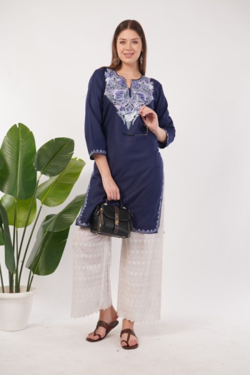 Shot of model wearing embroidered navy kurta and white pants on white background — Ckstudio Commercial Product Photography