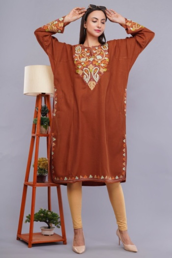 Shot of model wearing embroidered brown kurta with beige leggings on gray background — Ckstudio Commercial Product Photography