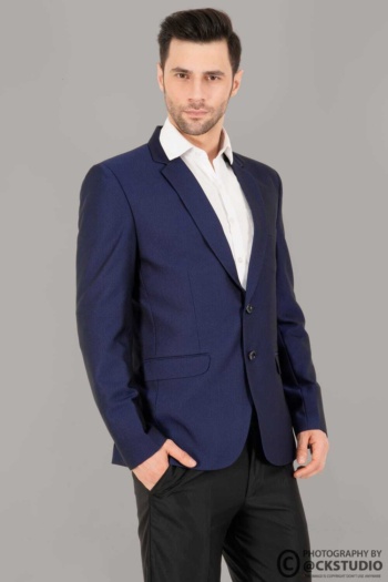 B) man in navy blazer and white shirt, black pants on gray background, Fashion Photography shot — Ckstudio