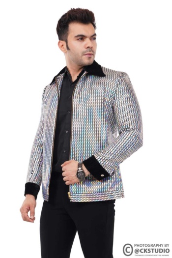 B man wearing reflective jacket, black shirt and pants, shot on white background, Fashion Photography — Ckstudio