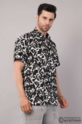 Shot of man wearing black and white patterned shirt on gray background — Ckstudio, Fashion Photography