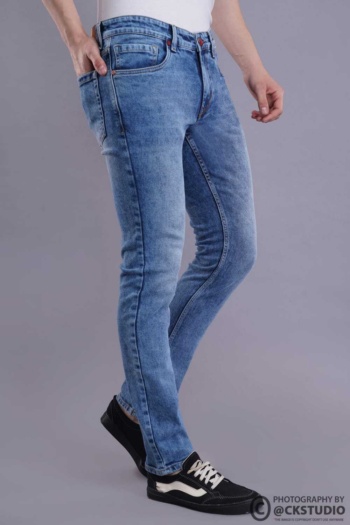 B) slim fit blue jeans on grey background, Fashion Photography shot — Ckstudio