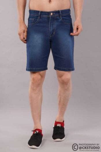 Shot of denim shorts worn by male model on gray background — Ckstudio, Fashion Photography
