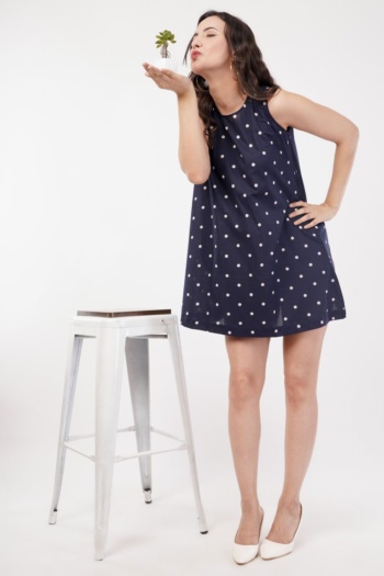 Ckstudio shot of model wearing navy polka dot dress on white background, Commercial Product Photography
