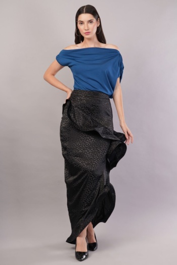 B) model wearing blue off-shoulder top and black patterned skirt, shot on gray background — Ckstudio, Garment Photography