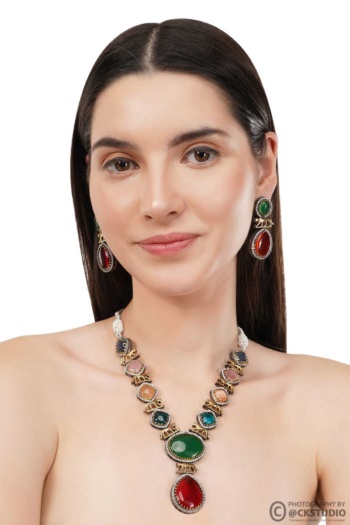 B) woman wearing colorful gemstone necklace and earrings, white background, Jewellery Photography shot — Ckstudio