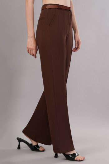 Ckstudio shot of brown trousers with belt and black heels on grey background — Garment Photography