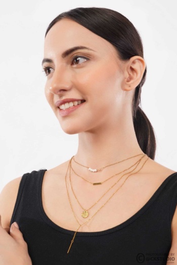 B) layered gold necklaces on woman, white background shot — Ckstudio, Jewellery Photography