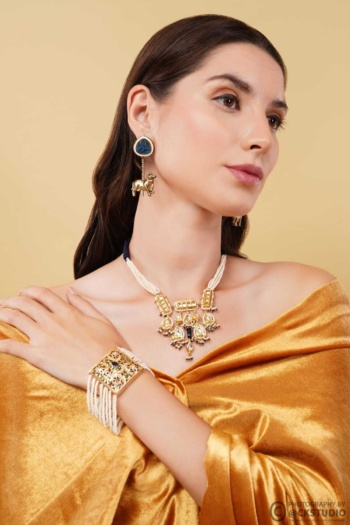Shot of woman wearing traditional jewelry on beige background, Commercial Product Photography — Ckstudio