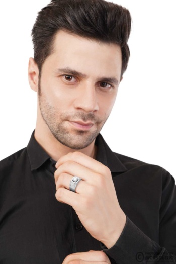 B) man wearing silver ring on hand, white background, Commercial Product Photography shot — Ckstudio