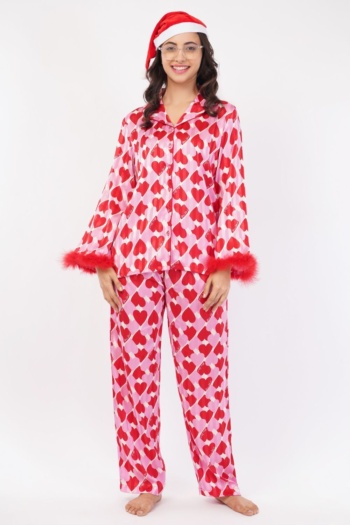 Shot of model wearing heart-patterned pajamas and Santa hat on white background — Ckstudio Commercial Product Photography