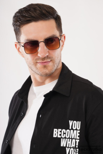 Ckstudio shot of a man wearing sunglasses against a clean white background — Commercial Product Photography.