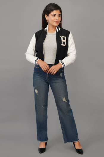 B) woman wearing varsity jacket and distressed jeans, shot on gray background — Ckstudio Commercial Product Photography
