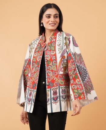 B) model wearing patterned jacket, beige background, Commercial Product Photography shot — Ckstudio