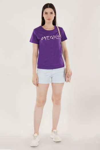 Ckstudio shot of model wearing purple graphic t-shirt and light shorts on plain white background, E-Commerce Photography