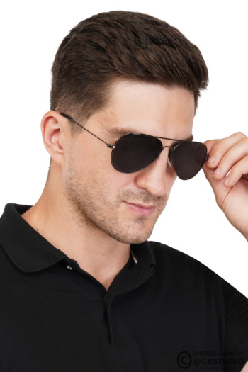 Ckstudio shot of man adjusting sunglasses on white background — Commercial Product Photography